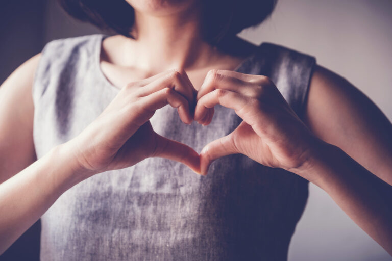 Woman,Making,Hands,In,Heart,Shape,,Heart,Health,Insurance,social,Responsibility,